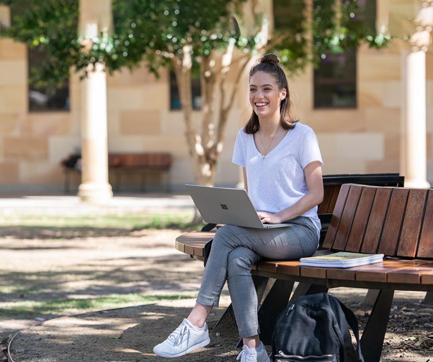 Student at St Lucia campus with laptop