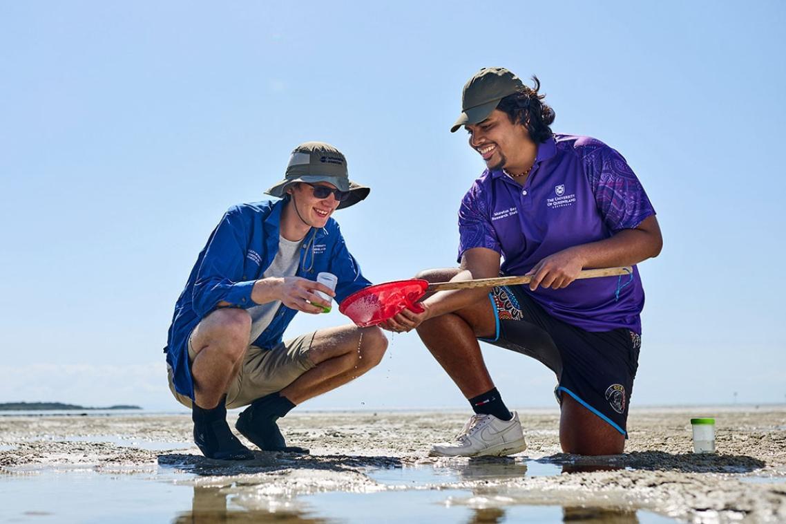 Students researching near a coastal rock pool